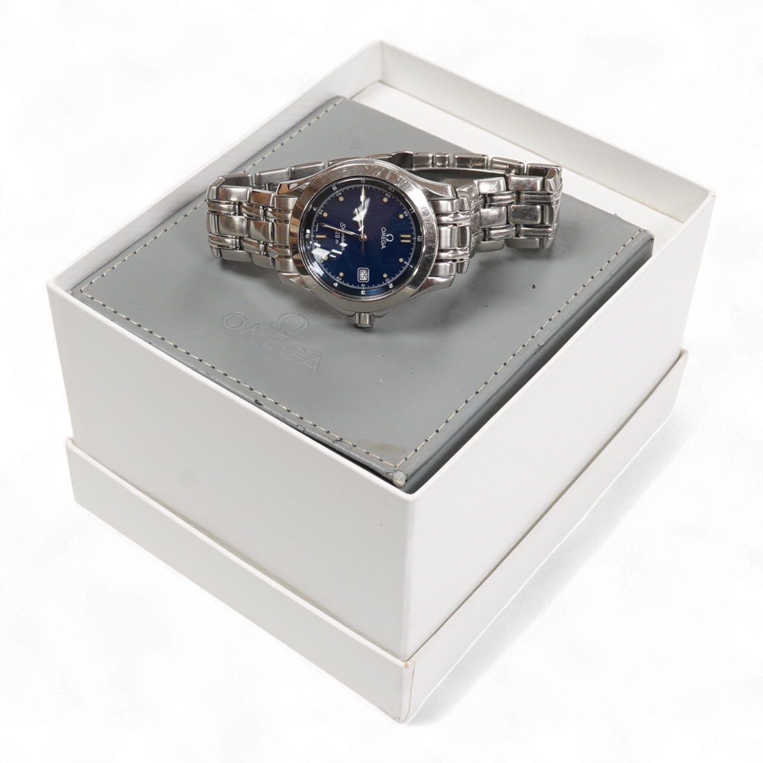 A gentleman's 1990's stainless steel Omega Seamaster quartz wrist watch, with blue dial dot markers and date aperture, case diameter 36mm, on a stainless steel Omega bracelet, with box and papers.